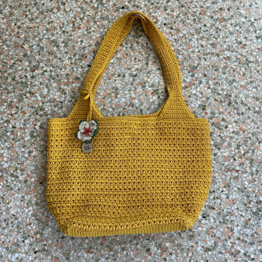 The Sak yellow woven hobo 120 bag with flower